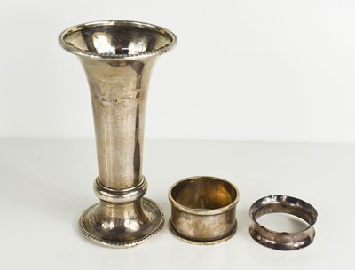 Lot 337 - A silver trumpet form vase with weighted base...