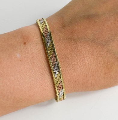 Lot 102 - A 9ct rose, yellow and white gold bracelet,...