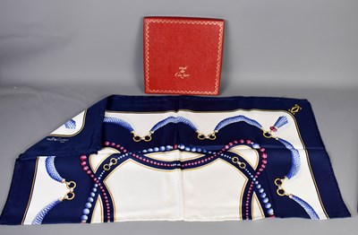 Lot 588 - A Must De Cartier silk scarf having a blue...