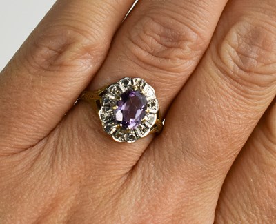 Lot 111 - A 9ct gold amethyst and diamond ring, size L,...