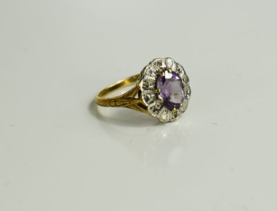 Lot 111 - A 9ct gold amethyst and diamond ring, size L,...