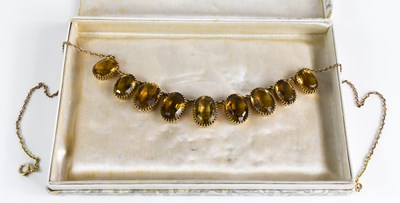 Lot 172 - A 9ct gold and citrine necklace, with...