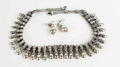 Lot 304 - A silver collar necklace, with snowdrop form...