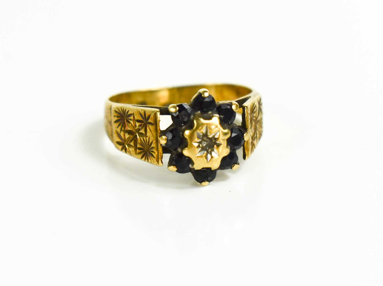 Lot 84 - A vintage 9ct gold ring with central chip...