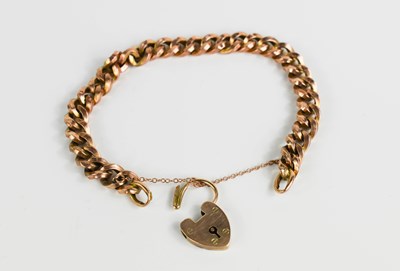 Lot 190 - A 9ct gold chain link charm bracelet, with 9ct...