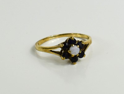 Lot 83 - A 9ct gold, sapphire and opal flowerhead ring,...