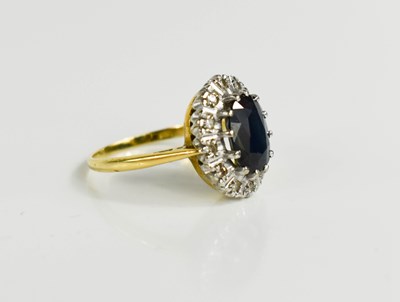 Lot 20 - A gold (tests as 18ct) sapphire and diamond...