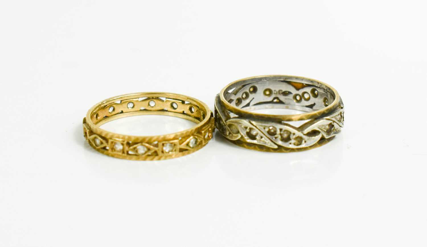 Lot 98 - Two 9ct gold and diamond eternity rings, Size...