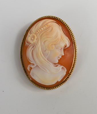 Lot 215 - A 9ct gold set cameo brooch, depicting female...
