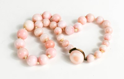 Lot 56 - A pink stone beaded necklace, likely angel...