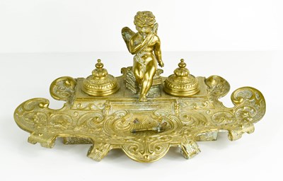 Lot 549 - A Victorian brass double inkwell with cherub.