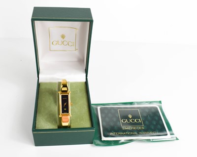 Lot 77 - A Ladies Gucci cocktail watch, complete with...