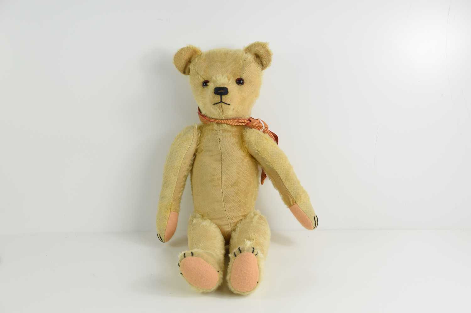 Lot 590 A 1930s/40s straw filled mohair teddy bear.