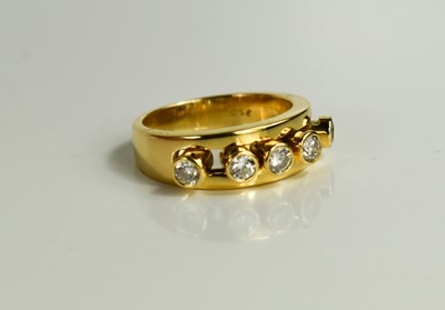 Lot 175 - A 18ct gold and diamond five stone ring, the...