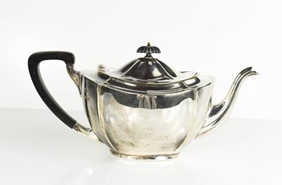 Lot 445 - A silver teapot, with ebonised handle,...