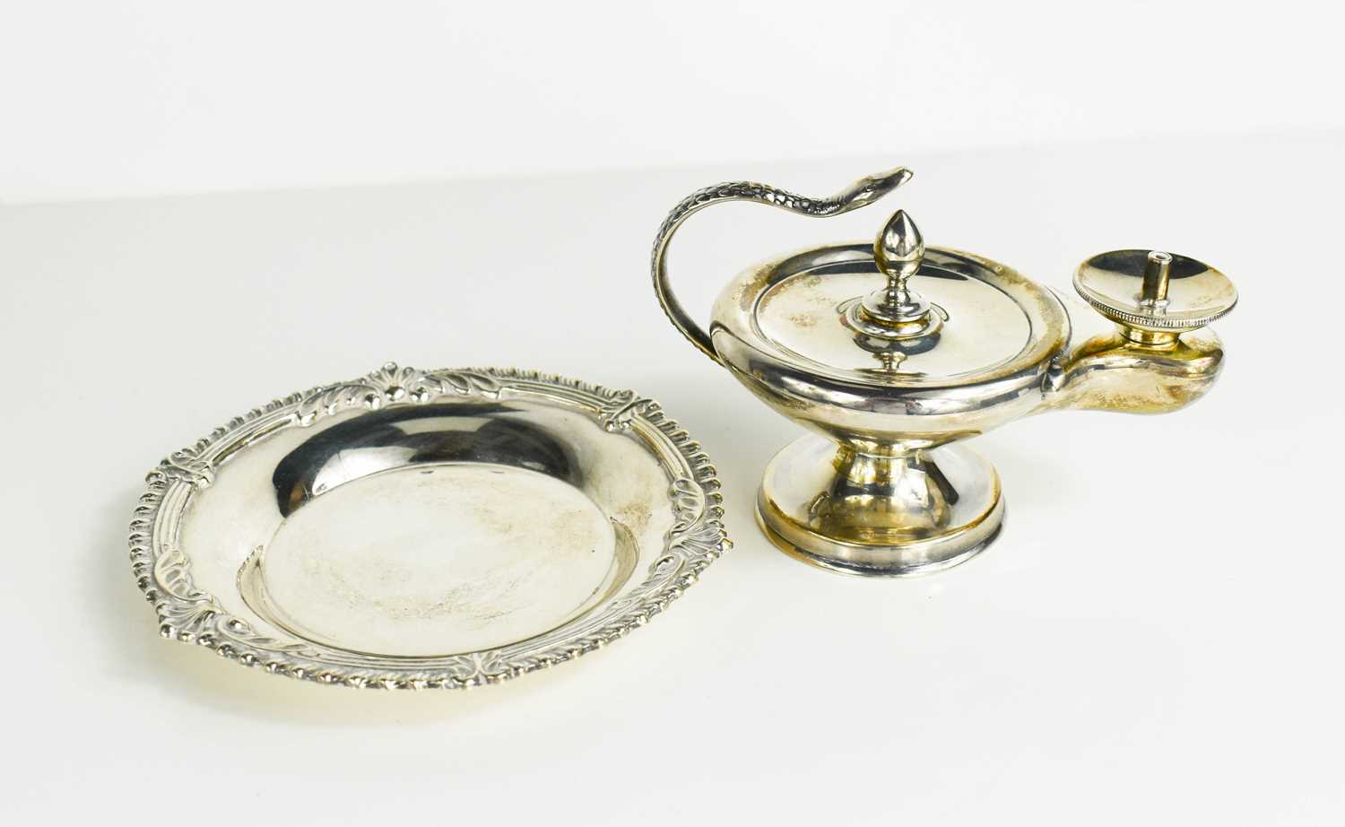 Lot 433 - A silver trinket dish with raised decorative...