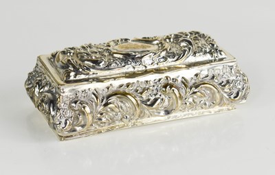 Lot 397 - A silver trinket box, embossed with foliage...