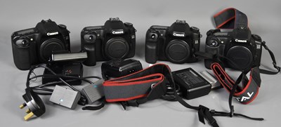 Lot 561 - Four Canon digital camera bodys, 20d, 30d and...