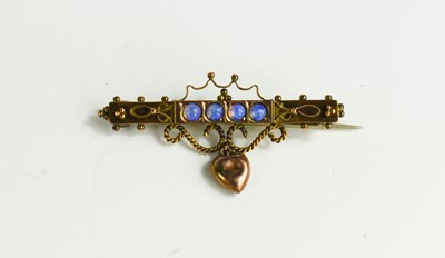 Lot 58 - A 9ct rose gold and opal set sweetheart brooch,...