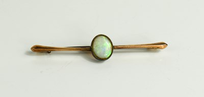 Lot 70 - A 9ct gold and oval opal set brooch / tiepin,...