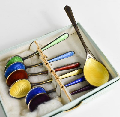 Lot 357 - A set of silver and coloured enamel tea spoons,...