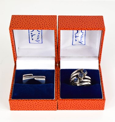 Lot 220 - Two silver modern designer rings, by John...