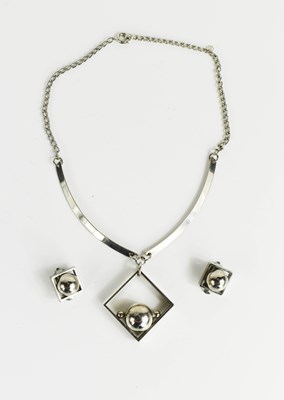 Lot 225 - A modernist silver pendant necklace, together...