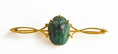 Lot 9 - A gold (tested as 18ct) and scarab beetle bar...