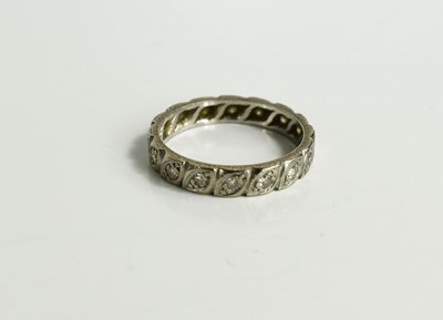 Lot 125 - A white gold and diamond eternity ring.