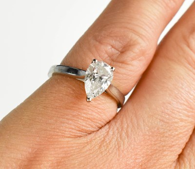 Lot 179 - An 18ct white gold and pear cut diamond...