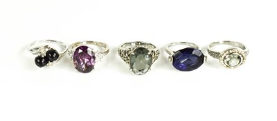 Lot 249 - Five dress rings, one set with an oval...