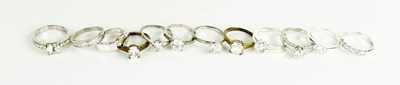 Lot 270 - A selection of ten solitaire dress rings, and...