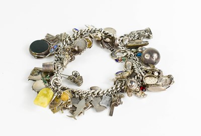 Lot 195 - A silver charm bracelet, with various charms.
