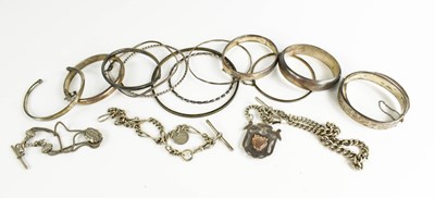 Lot 266 - A group of twelve silver bangles, including...