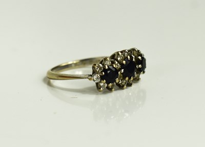 Lot 47 - An 18ct gold, diamond and sapphire ring, size...