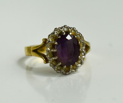 Lot 44 - An 18ct gold, diamond and amethyst ring, the...