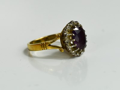Lot 44 - An 18ct gold, diamond and amethyst ring, the...