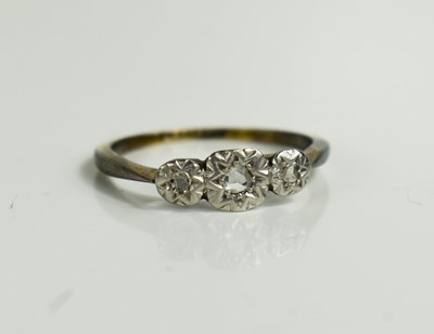 Lot 35 - A platinum and 9ct gold ring, with three chip...