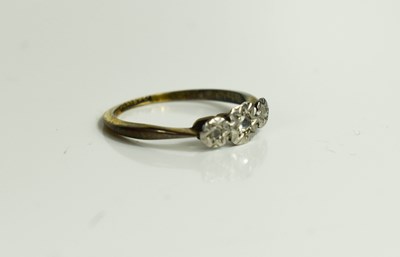 Lot 35 - A platinum and 9ct gold ring, with three chip...