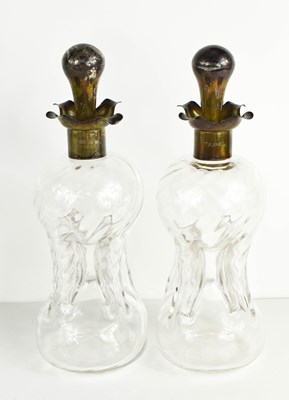 Lot 390 - A pair of antique silver and glass decanters,...