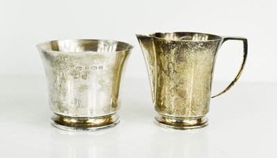 Lot 391 - A silver milk jug and sugar bowl, Birmingham...