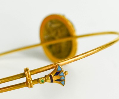 Lot 39 - A 14ct gold Egyptian bangle, with a stone...