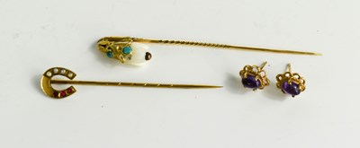 Lot 33 - A gold, turquoise and bone hat pin in the form...