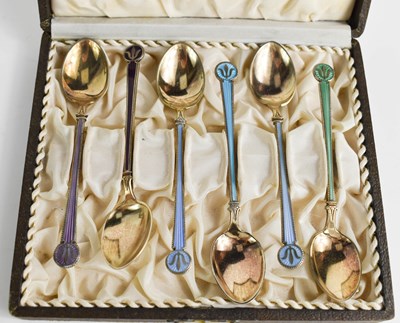 Lot 386 - A set of silver and enamelled tea spoons by...