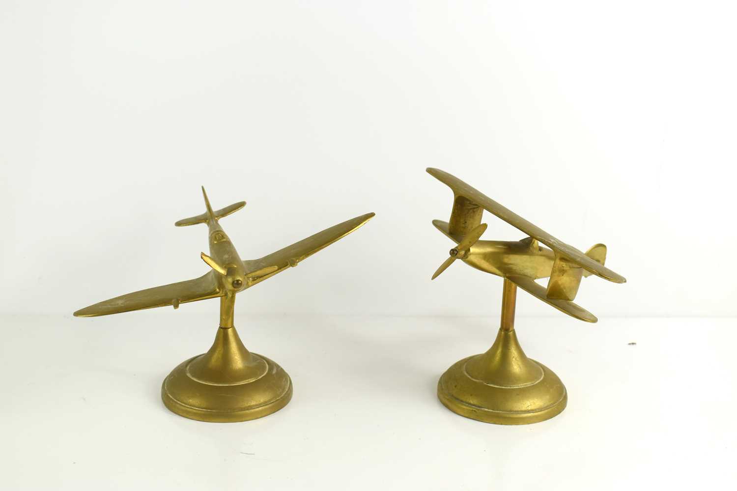 Lot 267 - Two brass desk models of a Spitfire and...