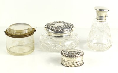 Lot 68 - Two silver topped dressing table bottles...