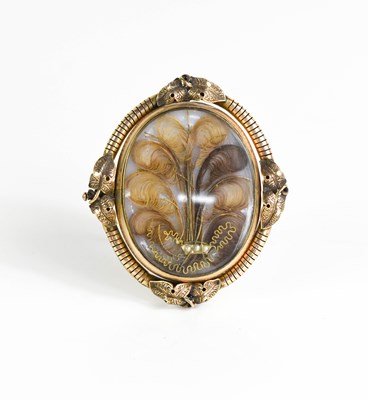 Lot 15 - A Victorian pinchbeck mourning brooch on stand,...