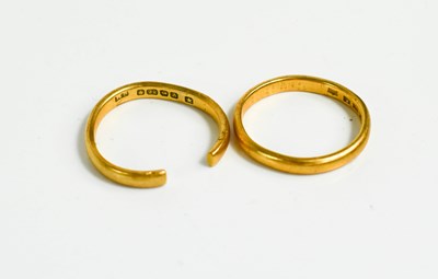 Lot 111 - Two 22ct gold wedding bands, one size L/M, the...