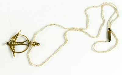 Lot 93 - A 9ct gold and seed pearl swallow form pendant...