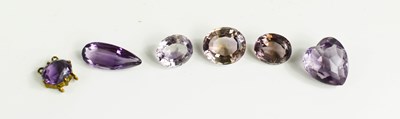 Lot 181 - A group of various loose amethysts, three oval...